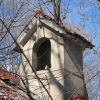 <p><strong>Mission, details</strong>: Bell tower with arched opening, red tile roof, and exposed scrollwork rafter tails. Chapel (Building 108), view northwest, January 2007.</p>